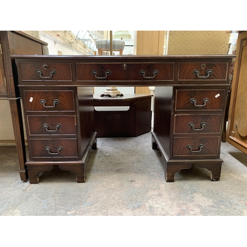 22 - A 19th century style mahogany pedestal writing desk with green leather insert - approx. 77cm high x ... 