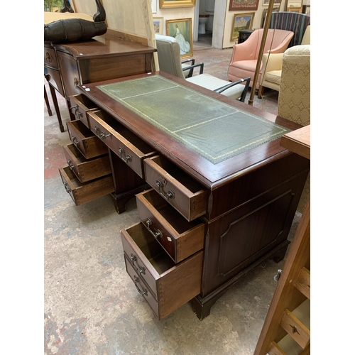 22 - A 19th century style mahogany pedestal writing desk with green leather insert - approx. 77cm high x ... 