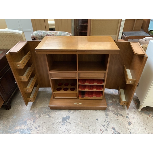 23 - A mid 20th century teak and burr walnut effect metamorphic cocktail cabinet/bar with marble inlay - ... 