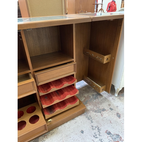 23 - A mid 20th century teak and burr walnut effect metamorphic cocktail cabinet/bar with marble inlay - ... 