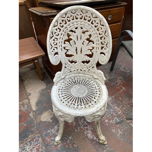 230 - A Victorian style white painted cast metal five piece patio set comprising circular table and four c... 