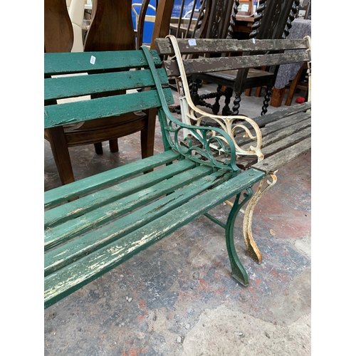 233 - A Victorian style green painted cast metal and wooden slatted two seater garden bench - approx. 122c... 