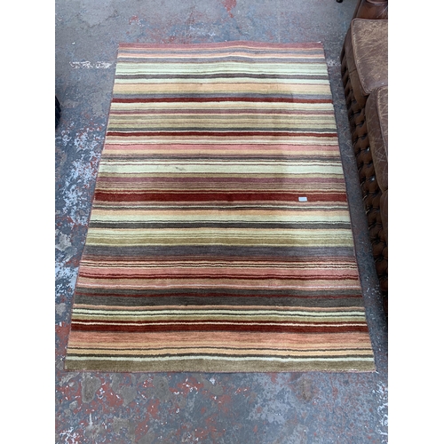 246 - A John Lewis Multistripe Harvest wool and cotton rug - approx. 180cm x 120cm