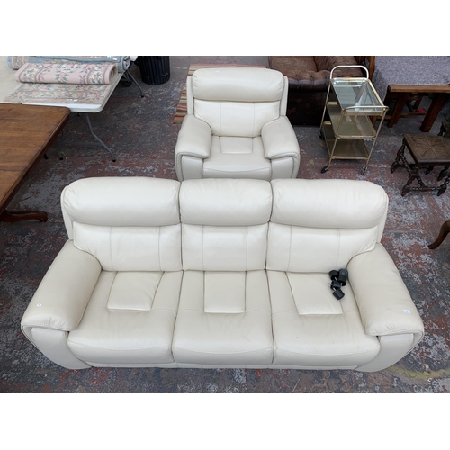 247 - A modern cream leather two piece lounge suite comprising three seater sofa and armchair