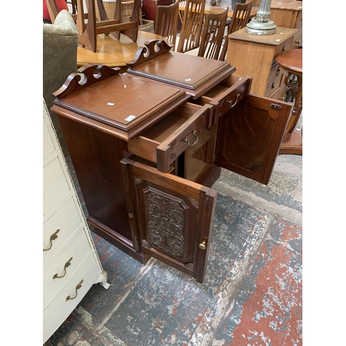 25 - A pair of Victorian style carved mahogany bedside cabinets - approx. 87cm high x 41cm wide x 41cm de... 