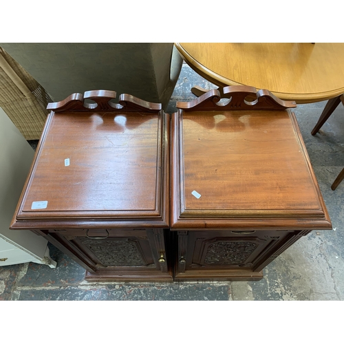 25 - A pair of Victorian style carved mahogany bedside cabinets - approx. 87cm high x 41cm wide x 41cm de... 