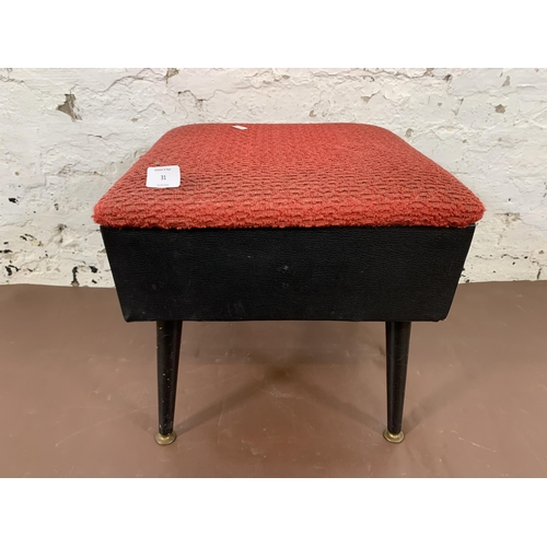 31 - A mid 20th century black vinyl and red fabric upholstered sewing stool on atomic supports - approx. ... 