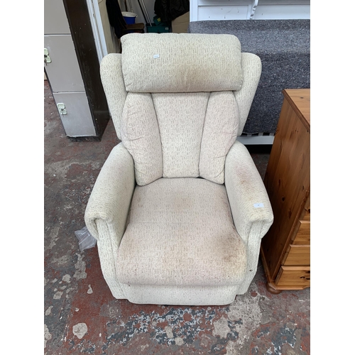 42 - A modern fabric upholstered electric rise and recline armchair with remote and power supply