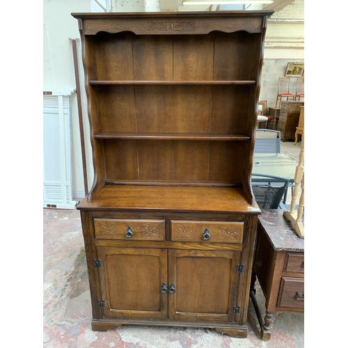 46 - A carved oak dresser - approx. 175cm high x 94cm wide x 40cm deep