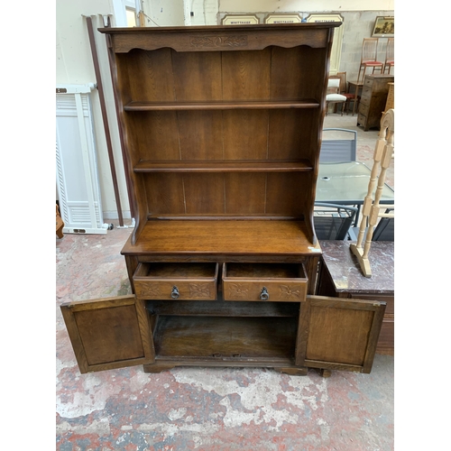 46 - A carved oak dresser - approx. 175cm high x 94cm wide x 40cm deep