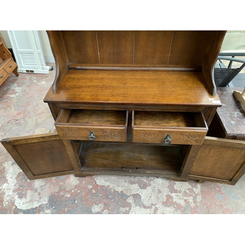 46 - A carved oak dresser - approx. 175cm high x 94cm wide x 40cm deep