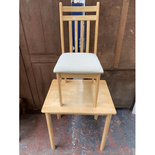 49 - A modern beech rectangular dining table and two chairs - approx. 75cm high x 60cm wide x 74cm long