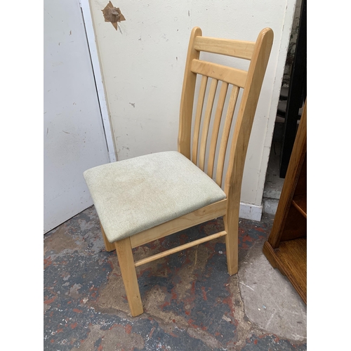 49 - A modern beech rectangular dining table and two chairs - approx. 75cm high x 60cm wide x 74cm long