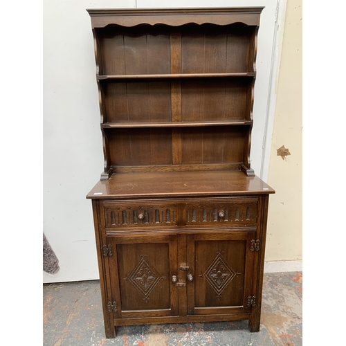 50A - A carved oak dresser - approx. 174cm high x 91cm wide x 43cm deep