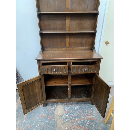 50A - A carved oak dresser - approx. 174cm high x 91cm wide x 43cm deep