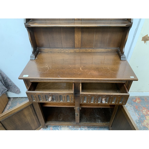 50A - A carved oak dresser - approx. 174cm high x 91cm wide x 43cm deep