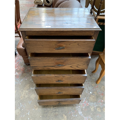 61 - A 1930s oak chest of drawers - approx. 105cm high x 60cm wide x 43cm deep