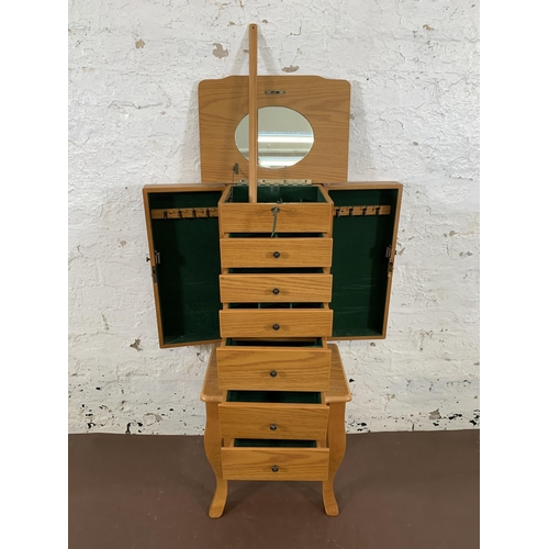 62 - A modern oak effect jewellery cabinet - approx. 98cm high x 40cm wide x 30cm deep