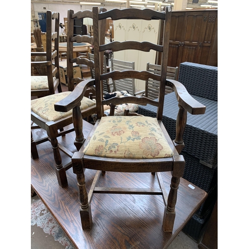 64 - An oak rectangular trestle dining table and six beech ladder back chairs - table approx. 83cm high x... 