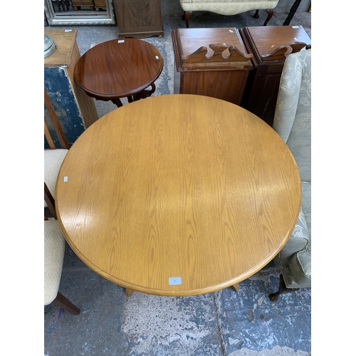 73 - A modern oak and beech circular pedestal dining table - approx. 74cm high x 100cm diameter