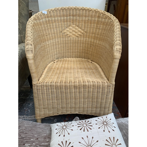 75 - A wicker and cane armchair with cushions