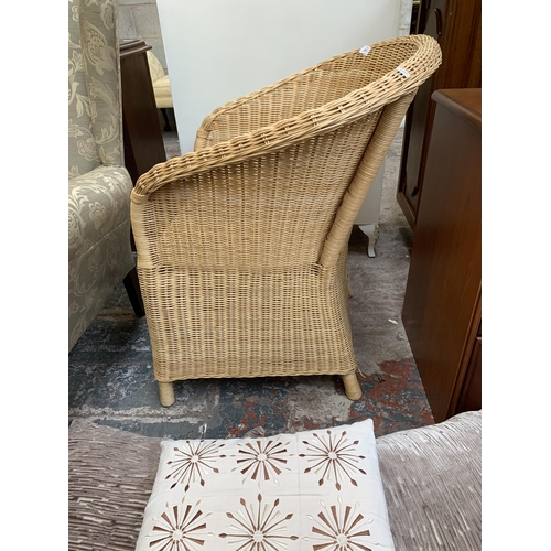 75 - A wicker and cane armchair with cushions