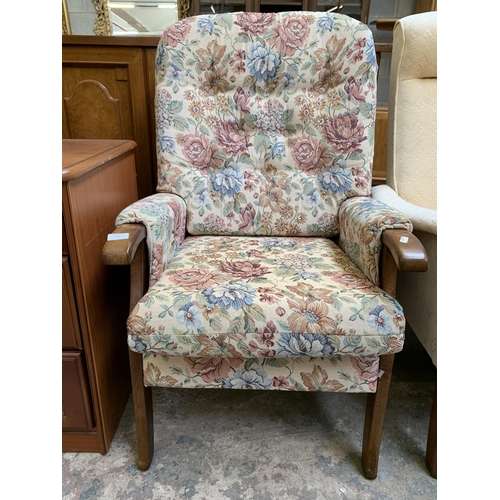 77 - A late 20th century beech and floral fabric upholstered armchair