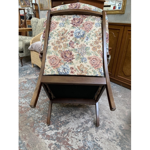 77 - A late 20th century beech and floral fabric upholstered armchair