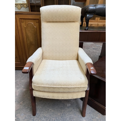 77A - A late 20th century beech and fabric upholstered armchair