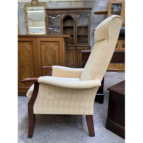 77A - A late 20th century beech and fabric upholstered armchair