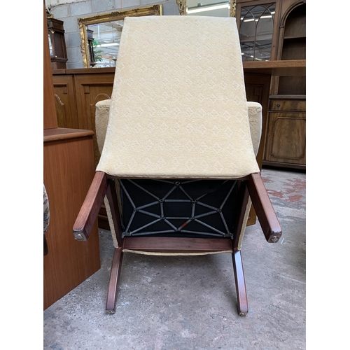 77A - A late 20th century beech and fabric upholstered armchair