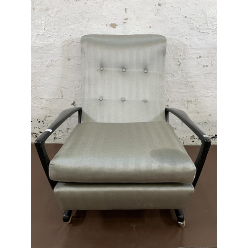 78B - A mid 20th century Parker Knoll PK1020 ebonised and fabric upholstered reclining armchair