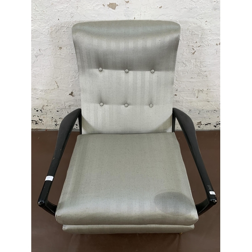 78B - A mid 20th century Parker Knoll PK1020 ebonised and fabric upholstered reclining armchair