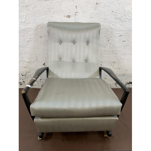 78C - A mid 20th century Parker Knoll PK1020 ebonised and fabric upholstered reclining armchair