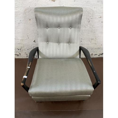 78C - A mid 20th century Parker Knoll PK1020 ebonised and fabric upholstered reclining armchair