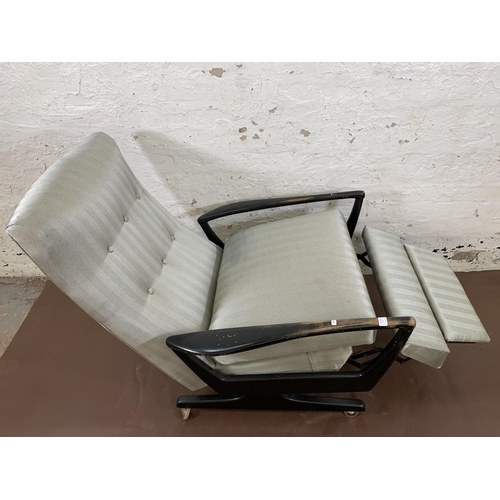 78C - A mid 20th century Parker Knoll PK1020 ebonised and fabric upholstered reclining armchair