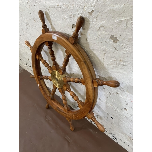 7A - An antique style hardwood ship's wheel wall hanging - approx. 92cm diameter