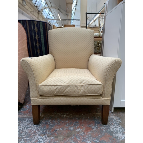 80 - A mid 20th century fabric upholstered armchair