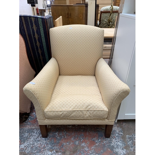 80 - A mid 20th century fabric upholstered armchair