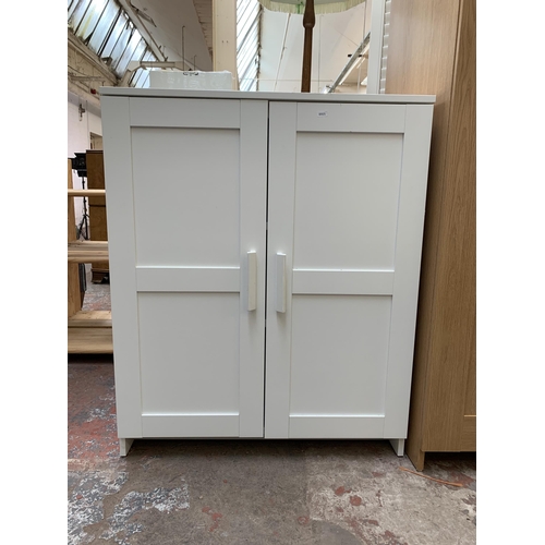 82 - An IKEA white laminate two door cabinet