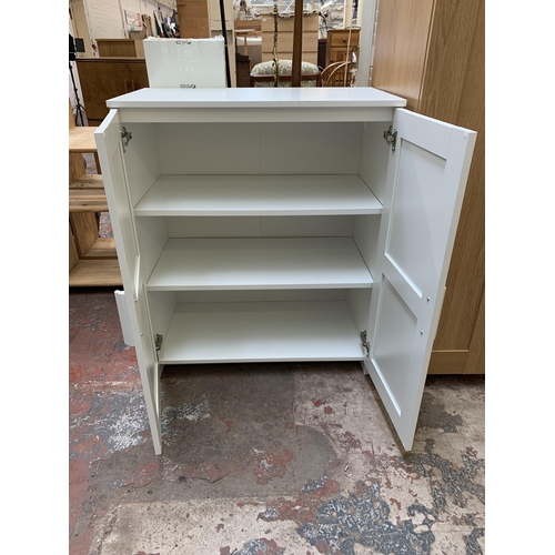 82 - An IKEA white laminate two door cabinet