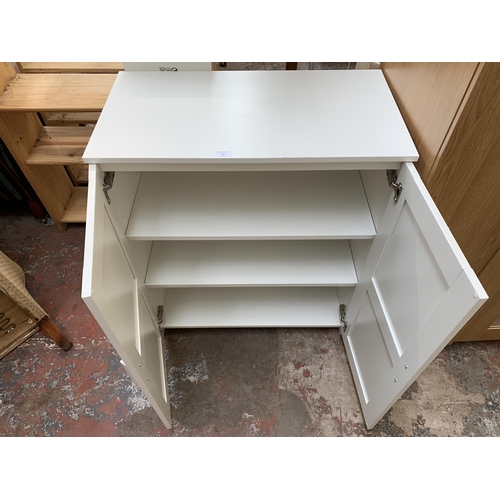 82 - An IKEA white laminate two door cabinet