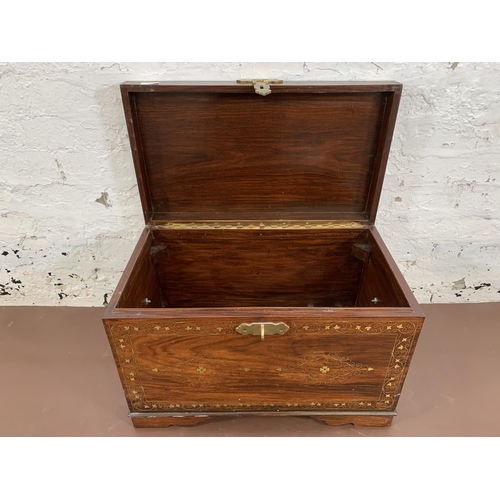 85 - An Indian brass and copper inlaid carved hardwood twin handled chest - approx. 41cm high x 61cm wide... 