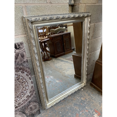 9 - A 19th century style silver painted framed bevelled edge wall mirror - approx. 110cm x 80cm