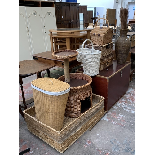 90 - Ten pieces of house clearance furniture to include seven wicker baskets, wicker cat tree, stained pl... 