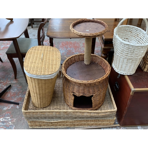 90 - Ten pieces of house clearance furniture to include seven wicker baskets, wicker cat tree, stained pl... 