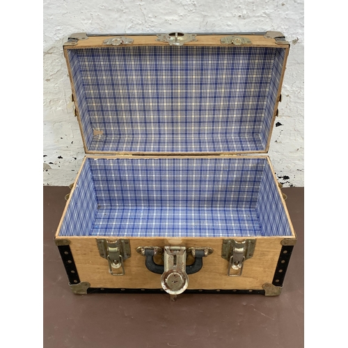 91 - A mid 20th century Overpond plywood and black plastic travel trunk