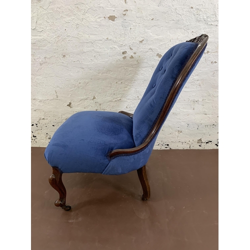 96 - A Victorian carved mahogany and blue fabric upholstered spoon back nursing chair