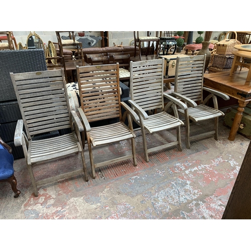 97 - Four Pagoda teak folding garden armchairs