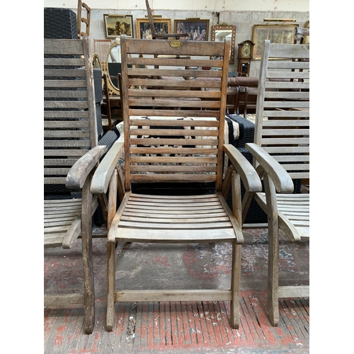 97 - Four Pagoda teak folding garden armchairs